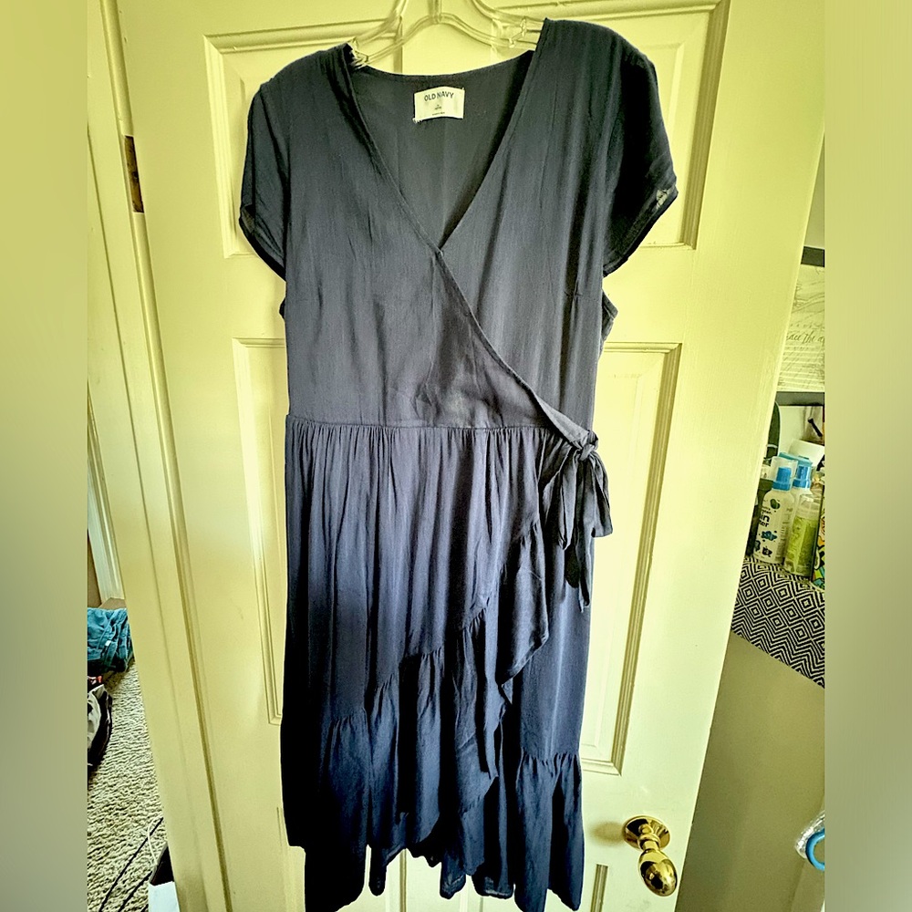 Navy blue midi length wrap dress with ruffle detail